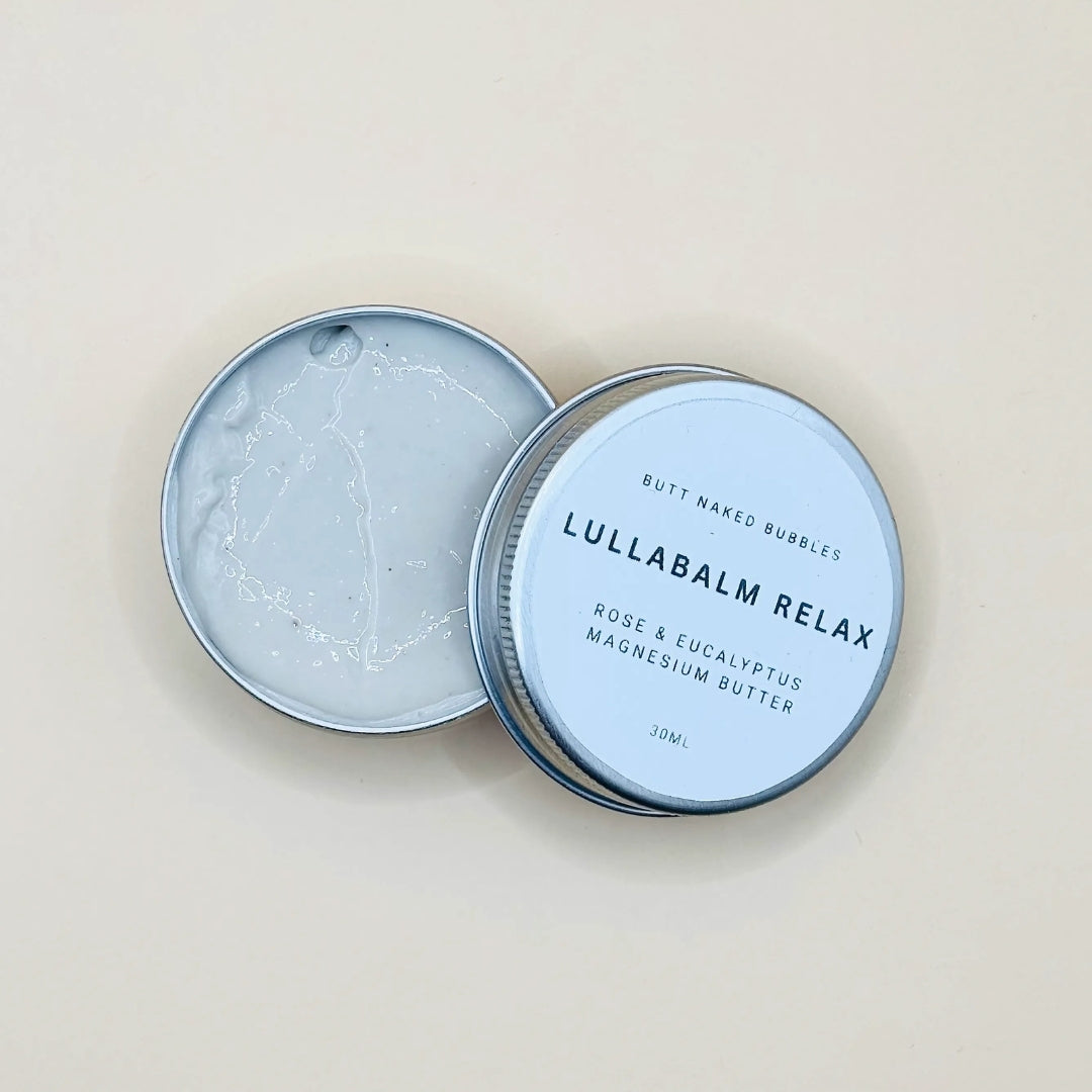 Lullabalm Relax container with lid open on a beige background