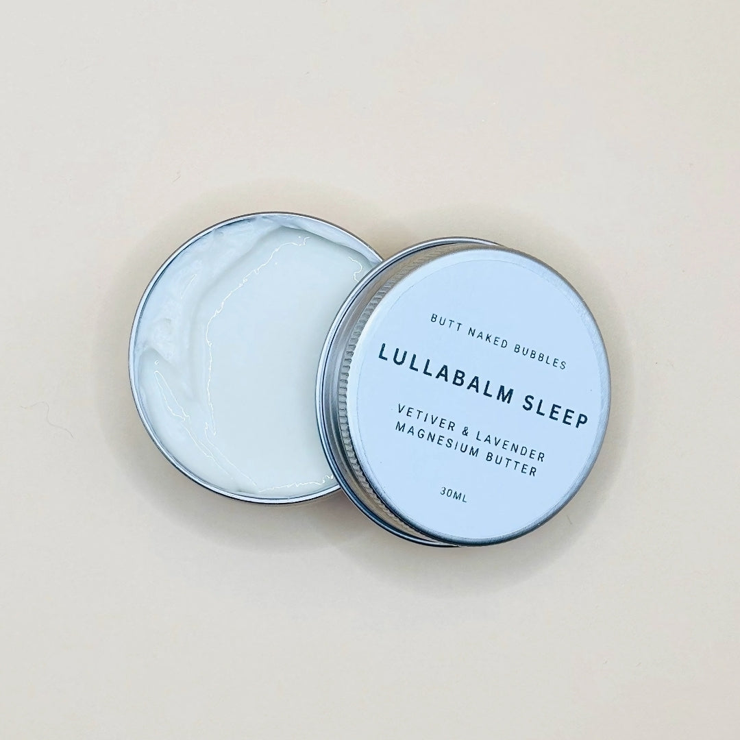 Lullabalm Sleep product with a white container and blue label on a beige background