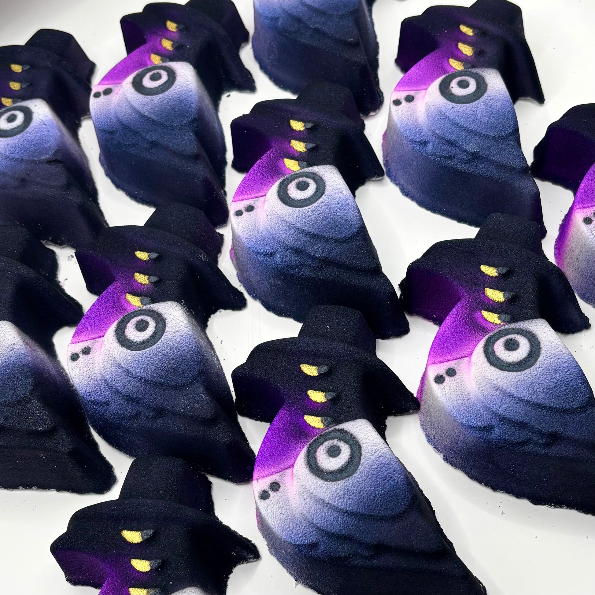 Sussie bird from k pop demon hunters bath bomb in blue, purple, white and black.